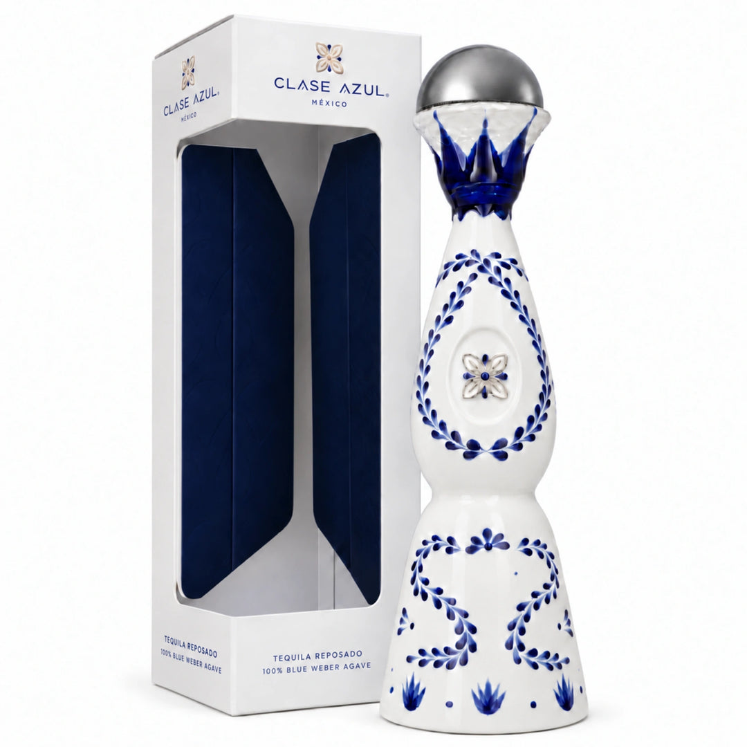 Clase Azul Tequila Reposado 100% Blue Weber Agave tequila bottle next to its white and navy blue packaging box, on a clean white background.