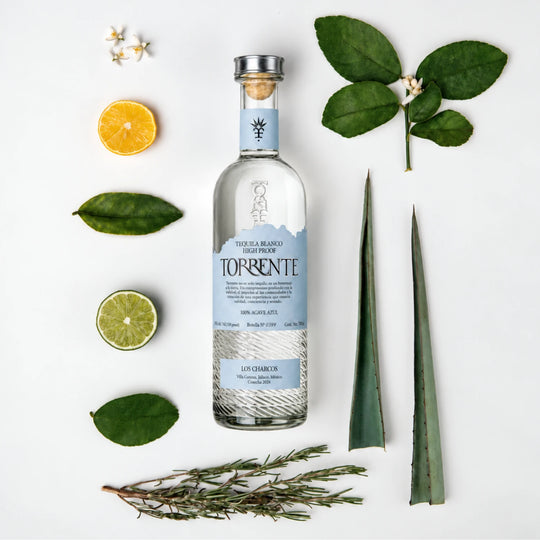 Bottle of Torrente Tequila Blanco High Proof 750mL surrounded by flavor notes of the tequila inside. 